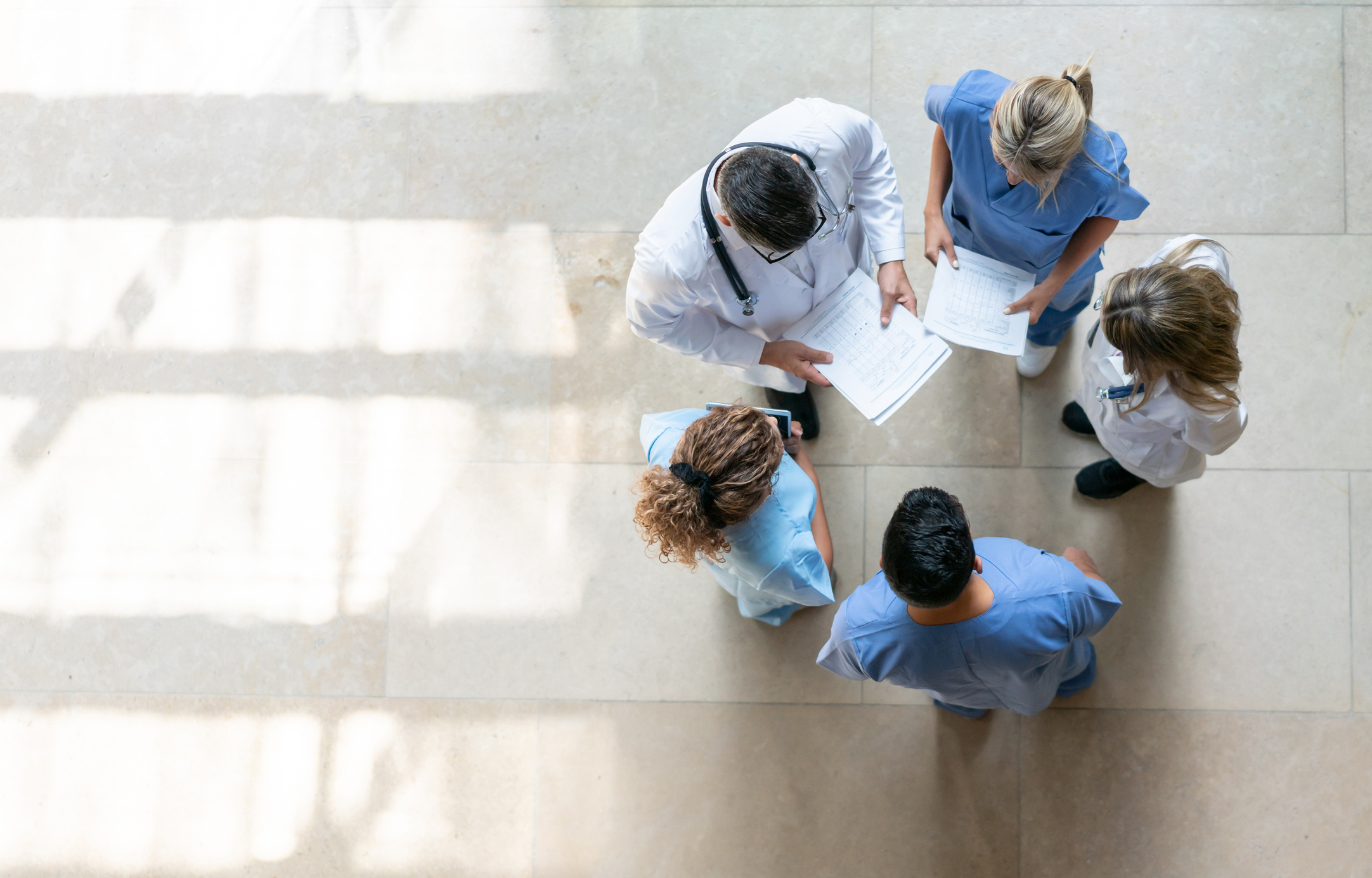 Healthcare professionals talking during a meeting.